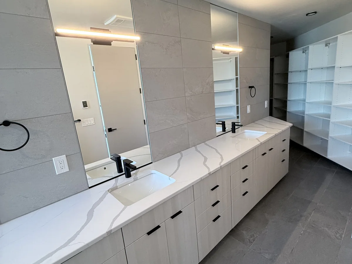 Bathroom vanity, mirrors, and floor cleaned
